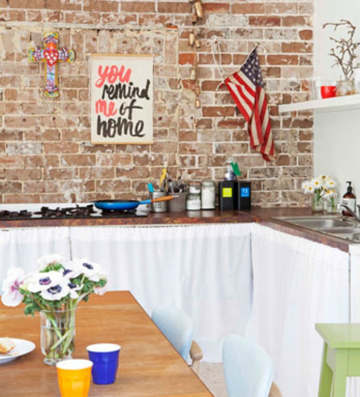 Coastal beach house kitchen with exposed brick walls Coastal kitchen with exposed brick