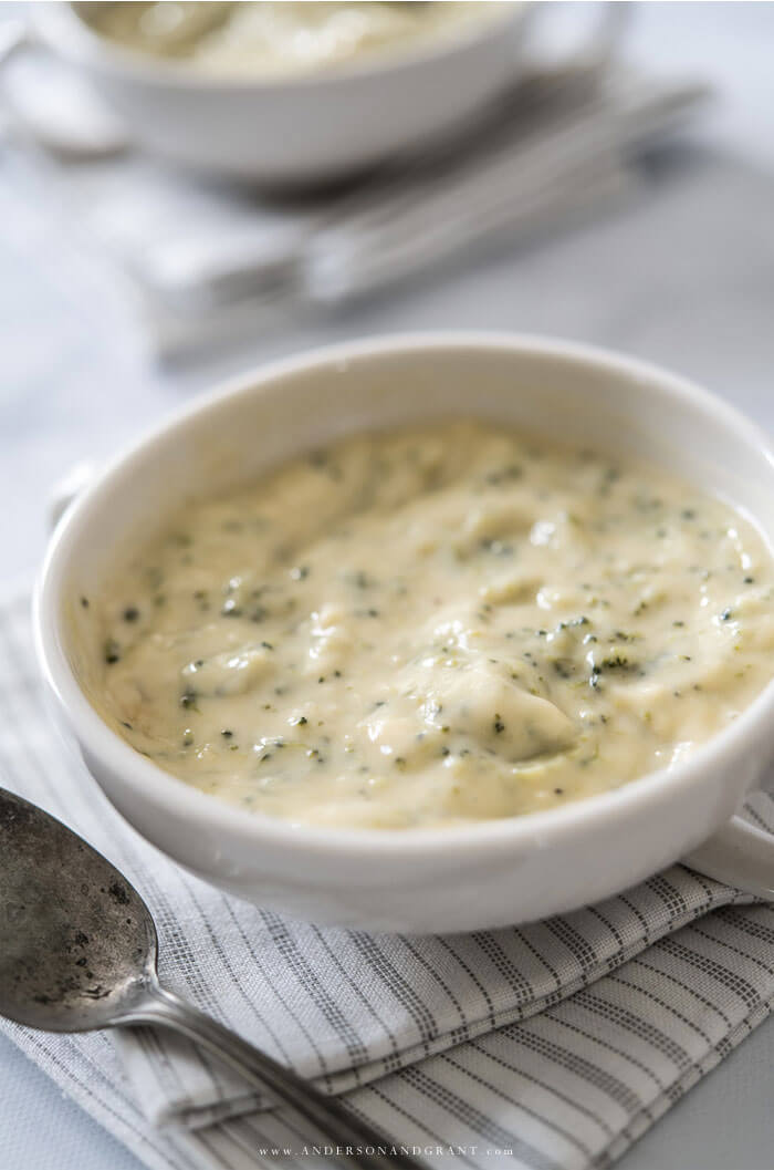 Bowl full of broccoli and cheese soup