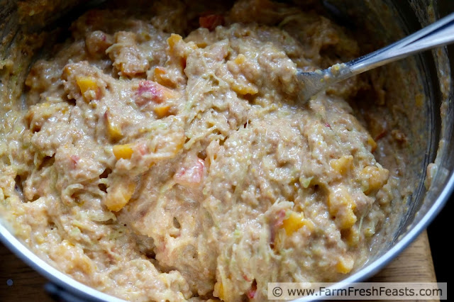 image of a bowl of Peach Zucchini muffin batter, ready to scoop into muffin pan and then bake