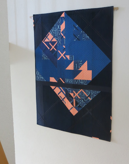 Luna Lovequilts - Eclat - A modern wall hanging quilt in navy and neon orange
