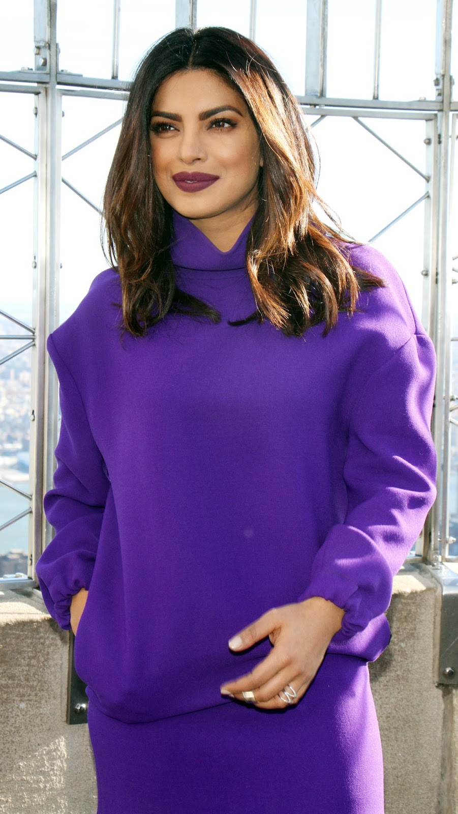 Priyanka Chopra Looks Sexy In a Purple Short Dress and Black Thigh High Boots During â€œQuanticoâ€ Promotion at The Empire State Building in New York City