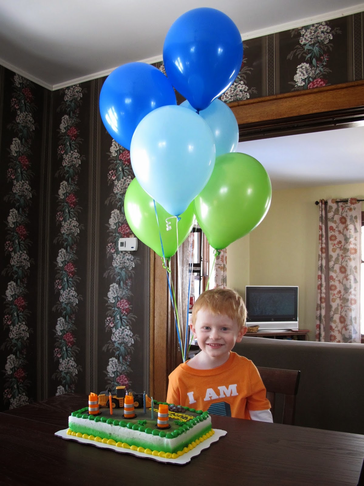 Porter with Balloons & Cake