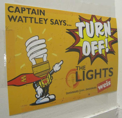 Cartoon superhero made out of a CFL lightbulb with admonition, Captain Wattely says TURN OFF THE LIGHTS