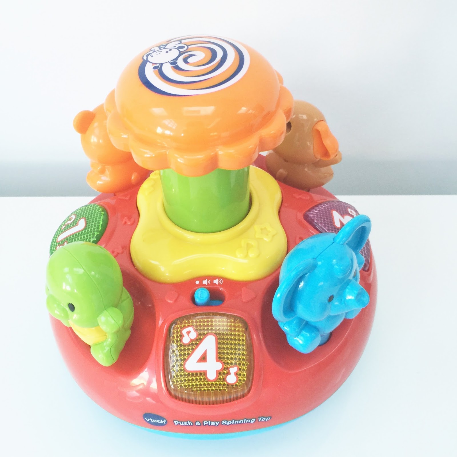 Multi-Coloured VTech Baby Push and Play Spinning Top Toy 