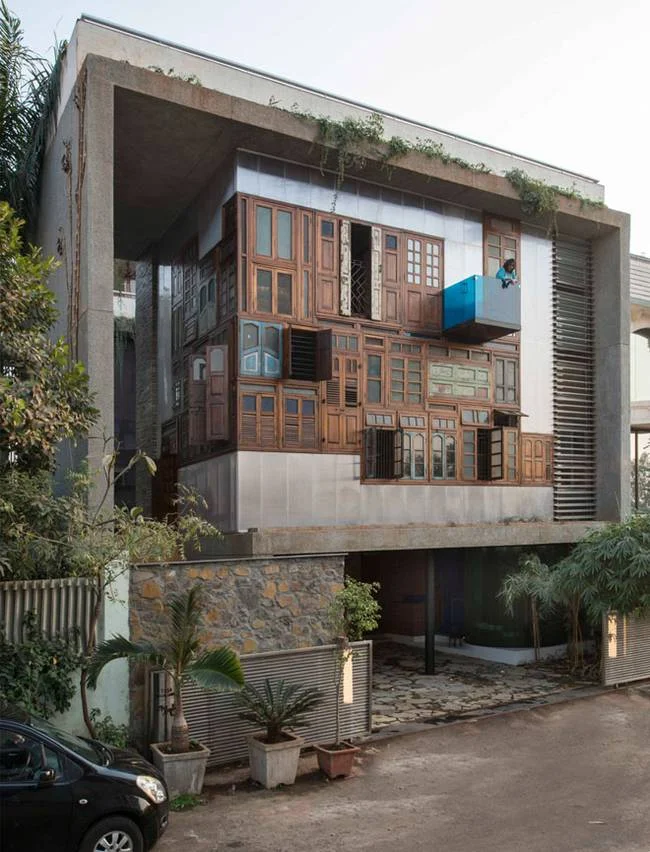 Elegant residence in Mumbai is collaged with recycled windows and doors