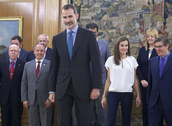 Queen letizia Hugo Boss blouse and trousers. She wore Magrit Shoes and carried Lidia-Faro python clutch. at Ferede