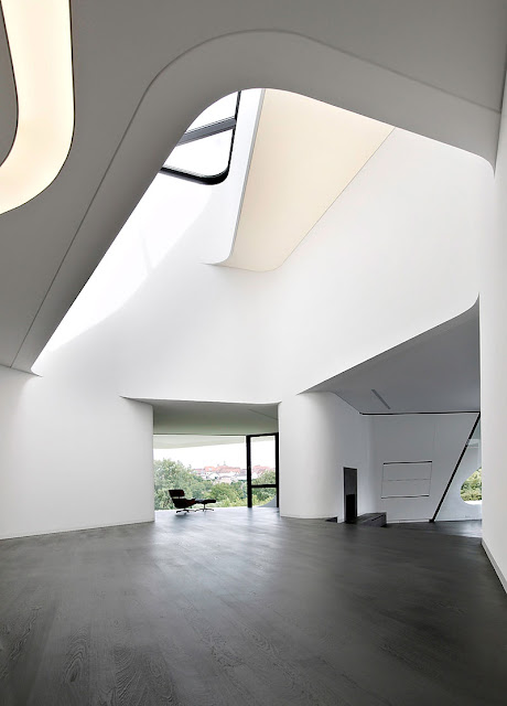 Wooden Floor and Bright Skylight Placed in the Ceiling