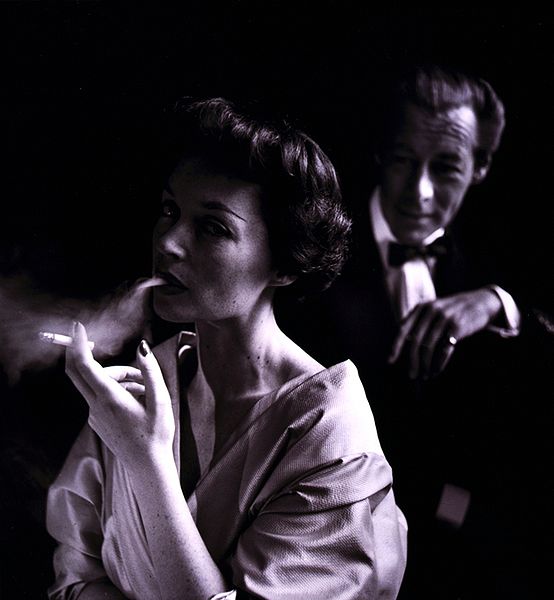 German actress Lilli Palmer (1914-1986), with husband Rex Harrison (1908-1990) in the background, photographed by Toni Frissell (1907-1988) in 1950