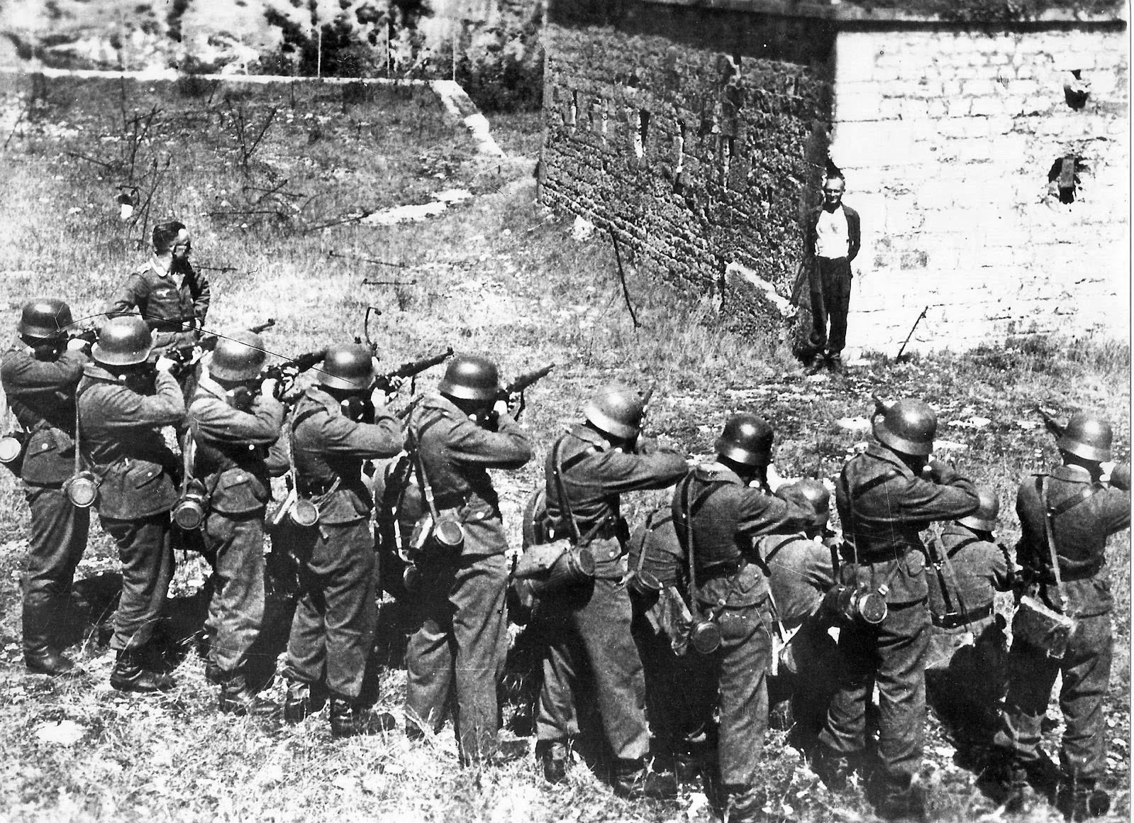 Georges Blind, a member of the French resistance, smiling at a German firing squad, October 1944 