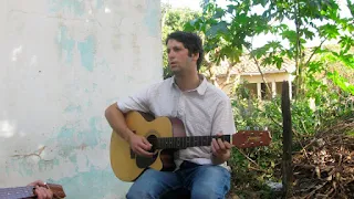 Peace Corp volunteer playing guitar in Paraguay