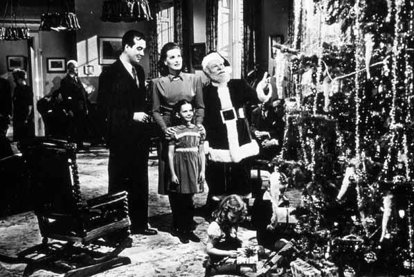 Kris, Susan, Doris and Fred look at a Christmas tree in Miracle on 34th Street