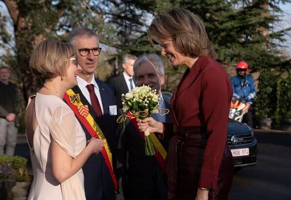 Queen Mathilde of Belgium visited a Horticultural School (Tuinbouwschool) in Melle. brown leather skirt silk blouse
