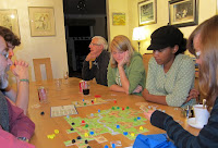 Carcassonne - The players watch as Sinead considers where to place her next tile