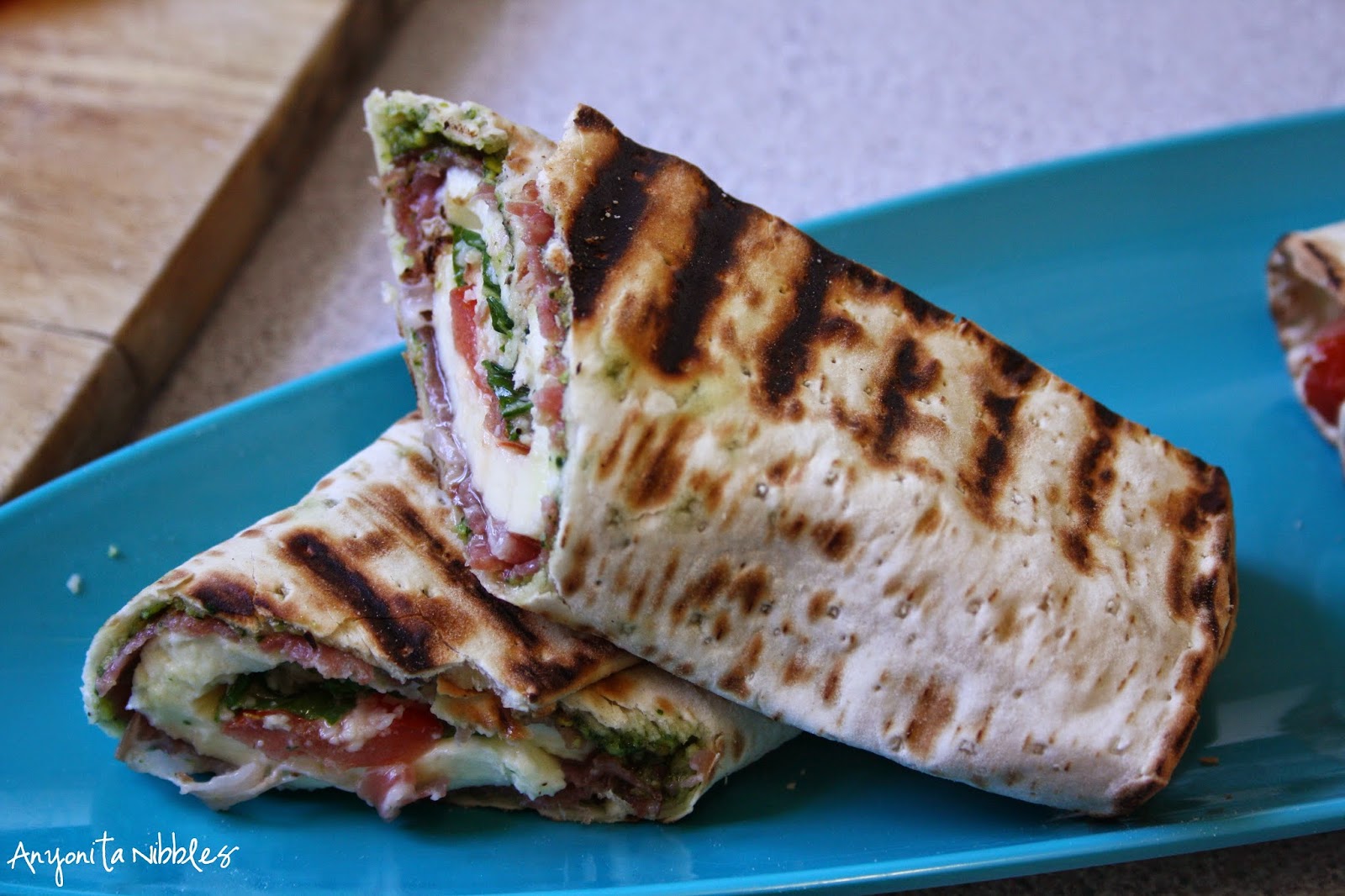 A sliced grilled caprese antipasti wrap from Anyonita Nibbles
