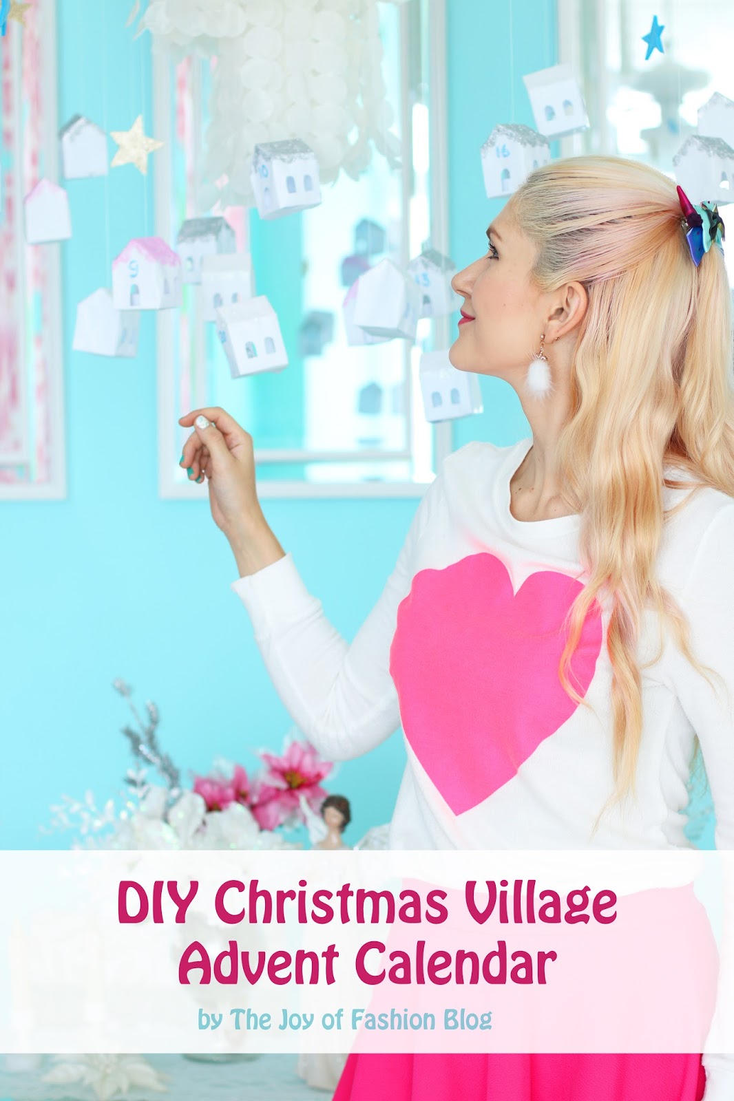 Use paper and glitter to create this cute DIY Advent Calendar made to look like a Christmas Village. Click through for full tutorial