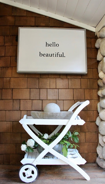 Cottage style on a charming porch with white bar cart and Hello Beautiful sign. My Sweet Savannah.