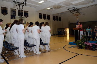 Practical Nursing instructor Penelope Hennessy leads graduates of Tri-County Regional’s Post-secondary Practical Nursing Program in reciting the Florence Nightingale Pledge during their commencement ceremony 