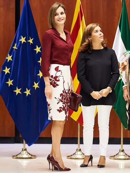 Queen Letizia attended an official lunch for Constitutional Tribunal. Felipe Varela satin blouse and floral skirt