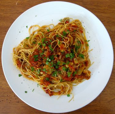 Angel hair pasta with purple cherokee tomatoes, eggplant, and artichoke hearts