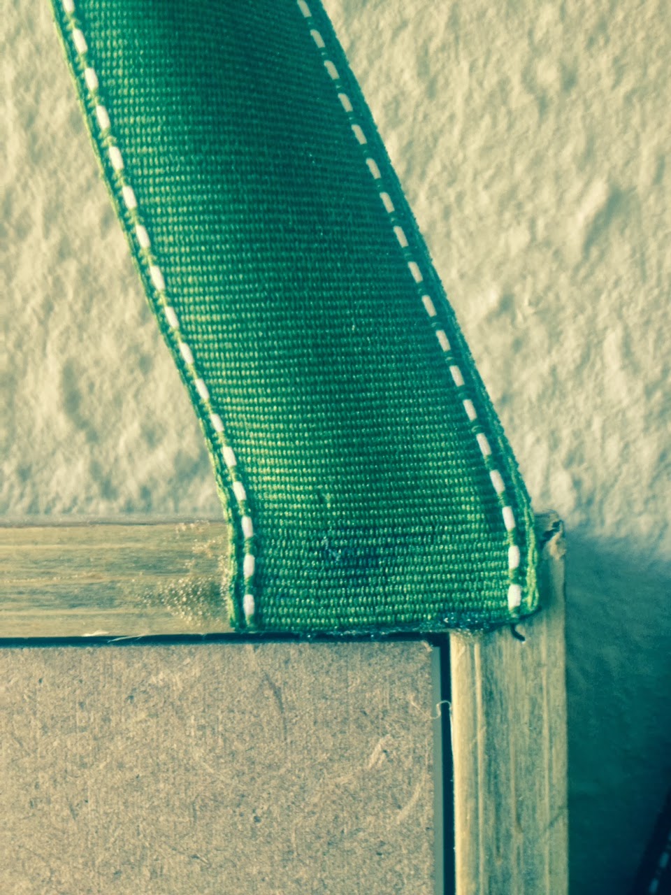 simple hanging photo frames with ribbon bows NATHAN SLATE