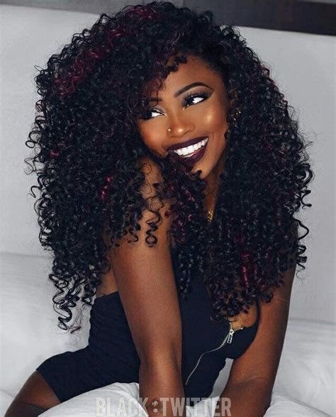 beautiful dark melanated black woman smiling