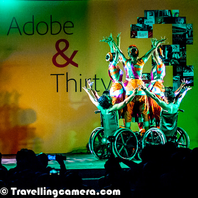This year ADOBE Systems is celebrating it's 30th Anniversary as a Software Company. This Photo Journey shares some of the celebration moments from Noida campus in India. Let's check this Photo Journey and know more about this great journey with exceptional products like Photoshop, Acrobat, Illustrator etc'Creativity', 'Big data' and 'Changing the world through digital experiences' - That’s how we know Adobe today !!! Adobe is proud to celebrate it's 30th Anniversary as a great software company. This great milestone is being celebrated in different Research & development offices across the world. Here we are sharing some of the moments from the evening at Noida with combination of Adobe veterans providing an insight into the last thirty years, recognizing Adobe CSR Champions for 2012 and a truly moving performance by 'Ability Unlimited'. Performers of Ability Unlimited were main attractions of the evening at Noida Office celebrations. We enjoyed various performances. Although I missed many of them. Most of these photographs are clicked during last part of the evening (for 15-20 mins). GURU SYED S PASHA in the middle with performers of Ability Unlimited Foundation !! Ability Unlimited Foundation is India's first professional dance theatre for persons with disabilities. This registered public charitable voluntary organization is dedicated to the cause and care of people with disabilities. AUF utilizes art as a vehicle to broaden the perspective and resolve issues including facing people with disabilities. It is committed to changing the apathy, negativity and fear that surrounds the education, employment and arts through the specially designed professional dance-theatre performances and innovative methodology as 'seeing is believing.' It gives the message of equality, dignity, equal opportunities and full participation of disabled people so that they can be on the same platform as the non-disabled. Our mission is to help the differently-abled all around the world realize their potential and to spread the joy of dance and theaterAbility Unlimited Foundation artistes performed at House of Commons at London, Cananda, USA and many parts of India. The moving speed of AUF artistes on wheel chairs are 150 Kms/hr and spinning speed of Wheel chairs are faster than Ballets Dancers spins. When they perform on stage they bring out indomitable spirit. They perform with great perfection and with the message 'They don't need mercy… They need Opportunity' In Indian Sign Language, waiving hands is sign for clapping. Since there were some deaf performers in the group of Ability Unlimited Foundation, it was necessary to train the audience about the way to applaud the performers.Adobe was founded in December 1982 by John Warnock and Charles Geschke, who established the company after leaving Xerox PARC in order to develop and sell the PostScript page description language. In 1985, Apple Computer licensed PostScript for use in its LaserWriter printers, which helped spark the desktop publishing revolution. The company name Adobe comes from Adobe Creek in Los Altos, California, which ran behind the houses of both of the company's founders. Adobe acquired its former competitor, Macromedia, in December 2005, which added newer software products and platforms such as ColdFusion, Dreamweaver, Flash and Flex to its product portfolio. For more, check out - http://en.wikipedia.org/wiki/Adobe_SystemCelebrations at Noida started with quick welcome of all employees and then quick speech by Adobe India veterans, who shared some inspiring facts about Adobe Systems and India Campus. Then some of the CSR volunteers were awarded to recognize their efforts in different areas. Adobe CSR is one of the biggest program in our country and Adobe as a company is focused about it's social responsibilities. After the quick round of award distributions Ability Unlimited started performing and they presented different flavors of performances. During the end, a great fireowork show and some snacks :GURU SYED S PASHA on stage telling about Ability unlimited Foundation and starting the performances on different themes.Vande Mataram Perfromance by Ability Unlimited Kids at Adobe Systems India (Noida Campus). 