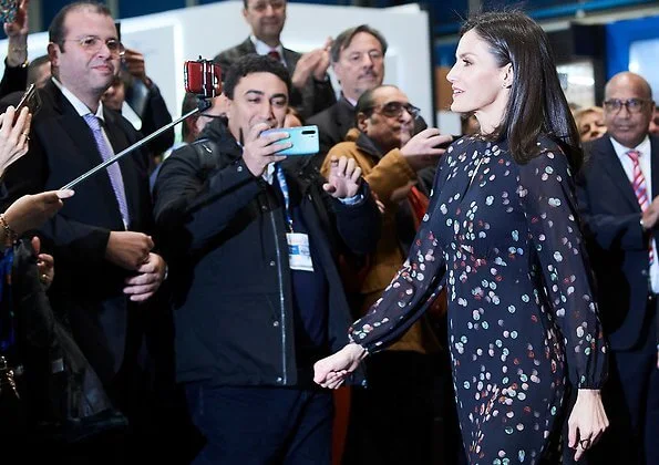 Queen Letizia wore a confetti-print shirt dress by Massimo Dutti. She wore Magrit red pumps. diamond earrings
