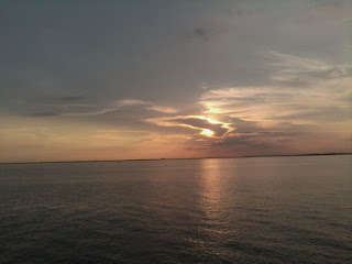 Sun coming out of clouds before sunset picture Sun coming out of clouds before sunset picture