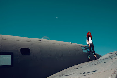 woman standing on plane, fashion shoot on airplane, airport, fashion photographer nyc