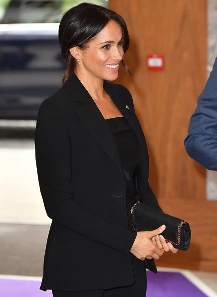 Meghan Markle wore Altuzarra Acacia blazer and wool Pants, Deitas Coco shantung camisole, Aquazzura pumps, carries Stella McCartney Bag