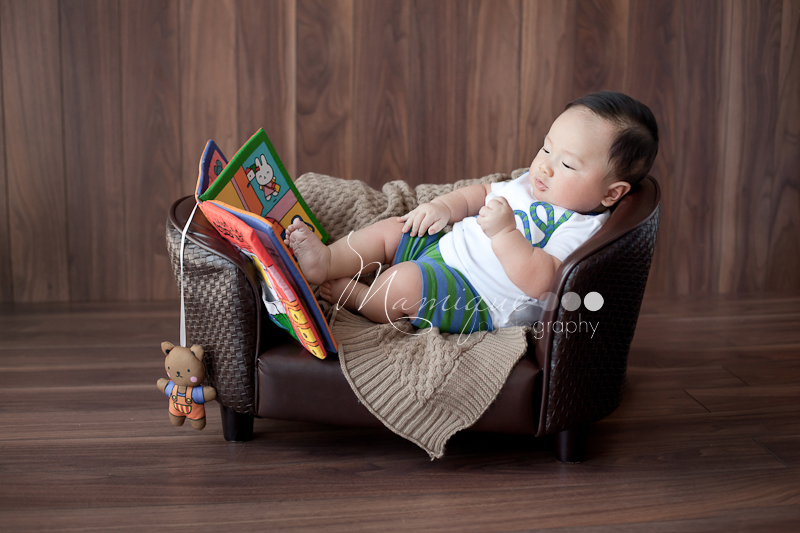 Cute boy reading on a couch Richmond BC