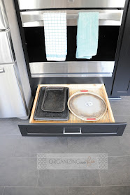 Cookie sheet drawer under double oven :: OrganizingMadeFun.com