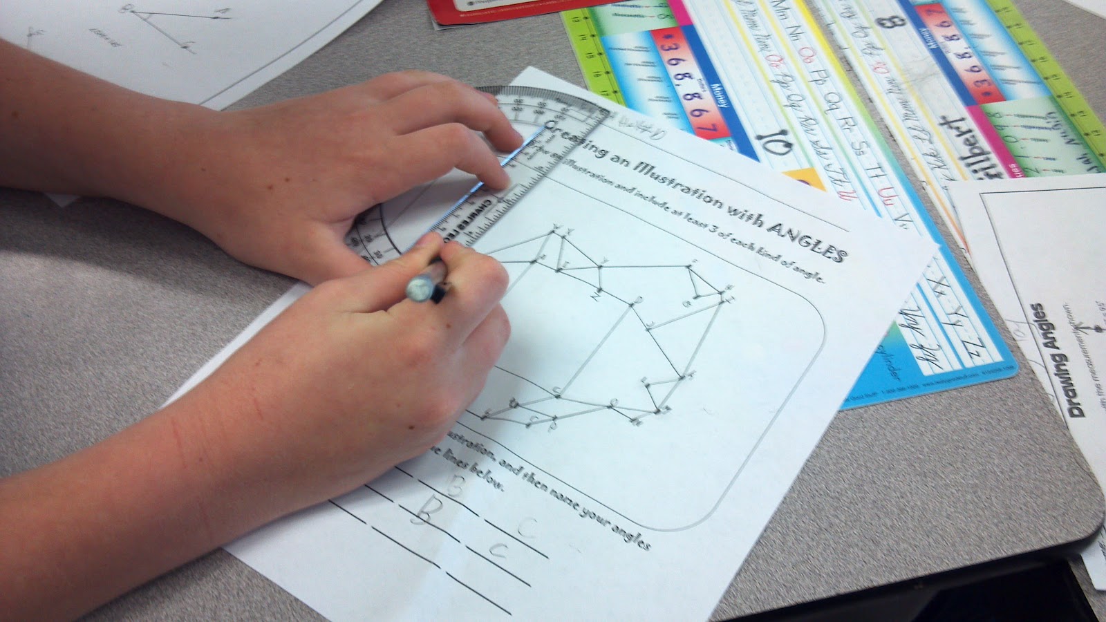 Student Using Protractor Lights, Camera, Learn: Measuring Angles