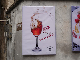 poster with liquid sloshing out of a wine glass with "Good design is turning complexity into simplicity"