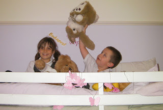 schoolchildren on top bunk bed