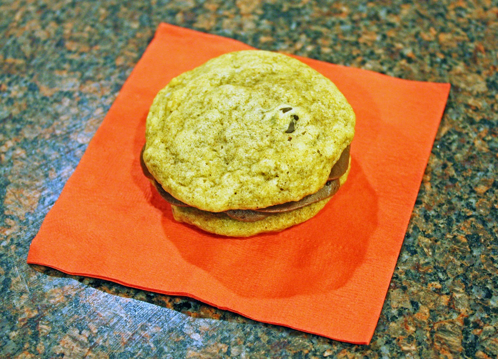 vegan chocolate chip pumpkin spice cookie sandwiches with chocolate buttercream