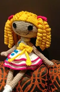 http://www.ravelry.com/patterns/library/lala-doll-in-white-and-yellow