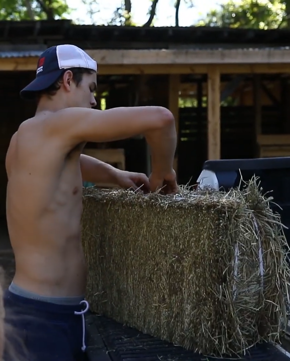 Hayes Grier shirtless farm work.