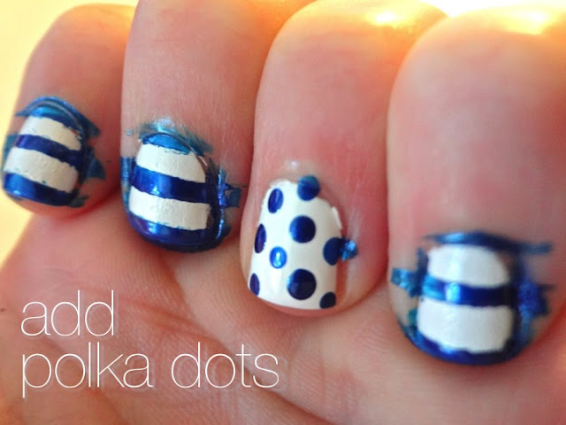 adding blue polka dots to accent nail