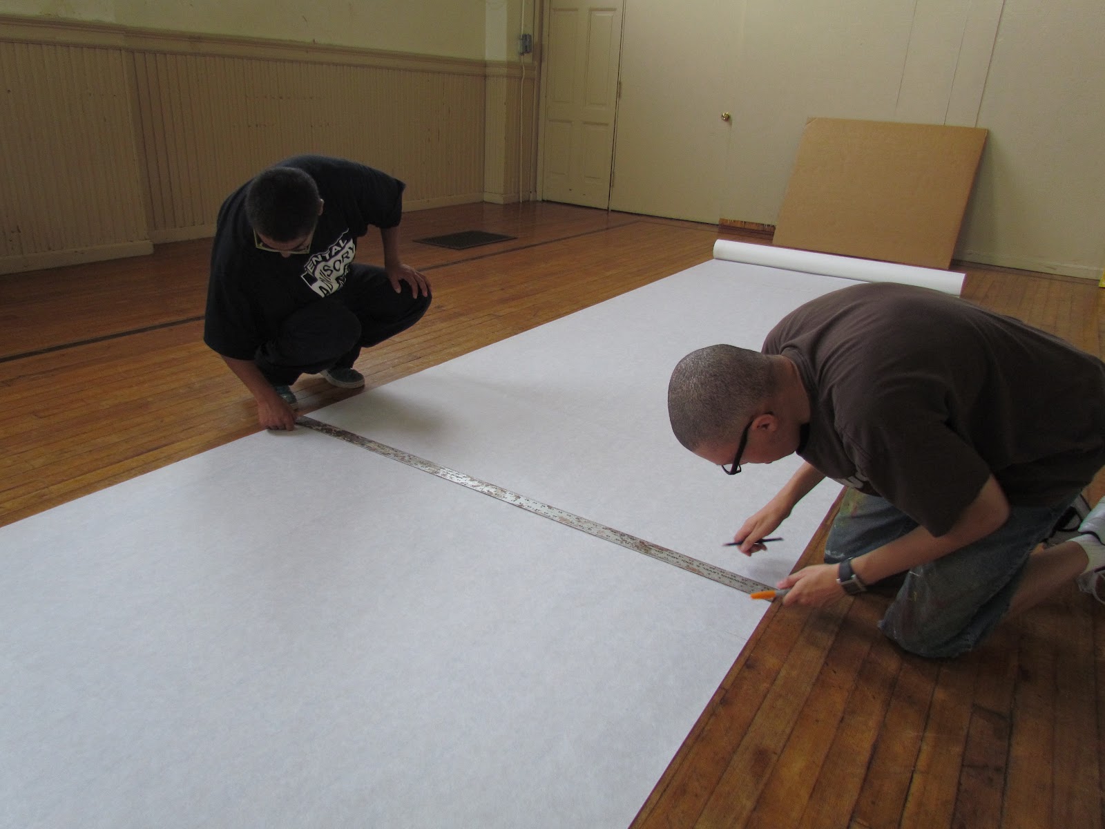 Aqui y Alla Mural Project Day 3 Parachute cloth priming