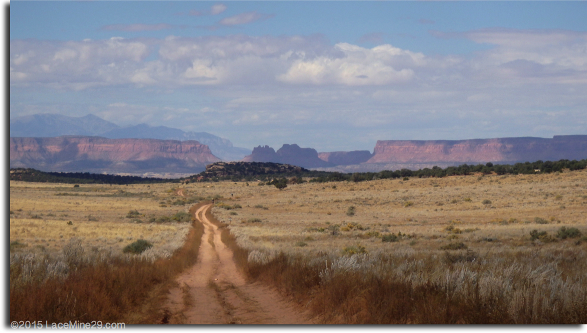 image of long dirt road with plateau in background