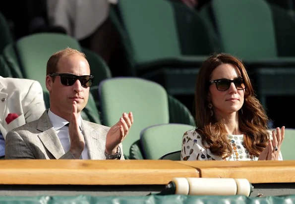 Duchess Catherine at the Men's Final of the Wimbledon. Kate Middleton wore Alexander McQueen Obsession Print Short Sleeve Dress. Brora Gold Charm Earrings, and carried her L.K. Bennett Natalie clutch.