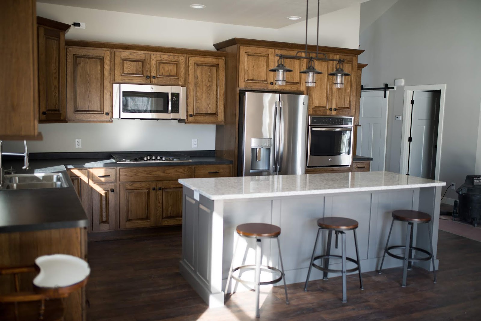 The Shopp Hickory gray island and custom stairway