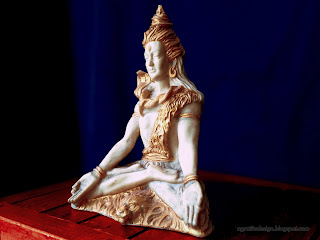Side View Lord Shiva Mini Statue On The Table With Blue Background