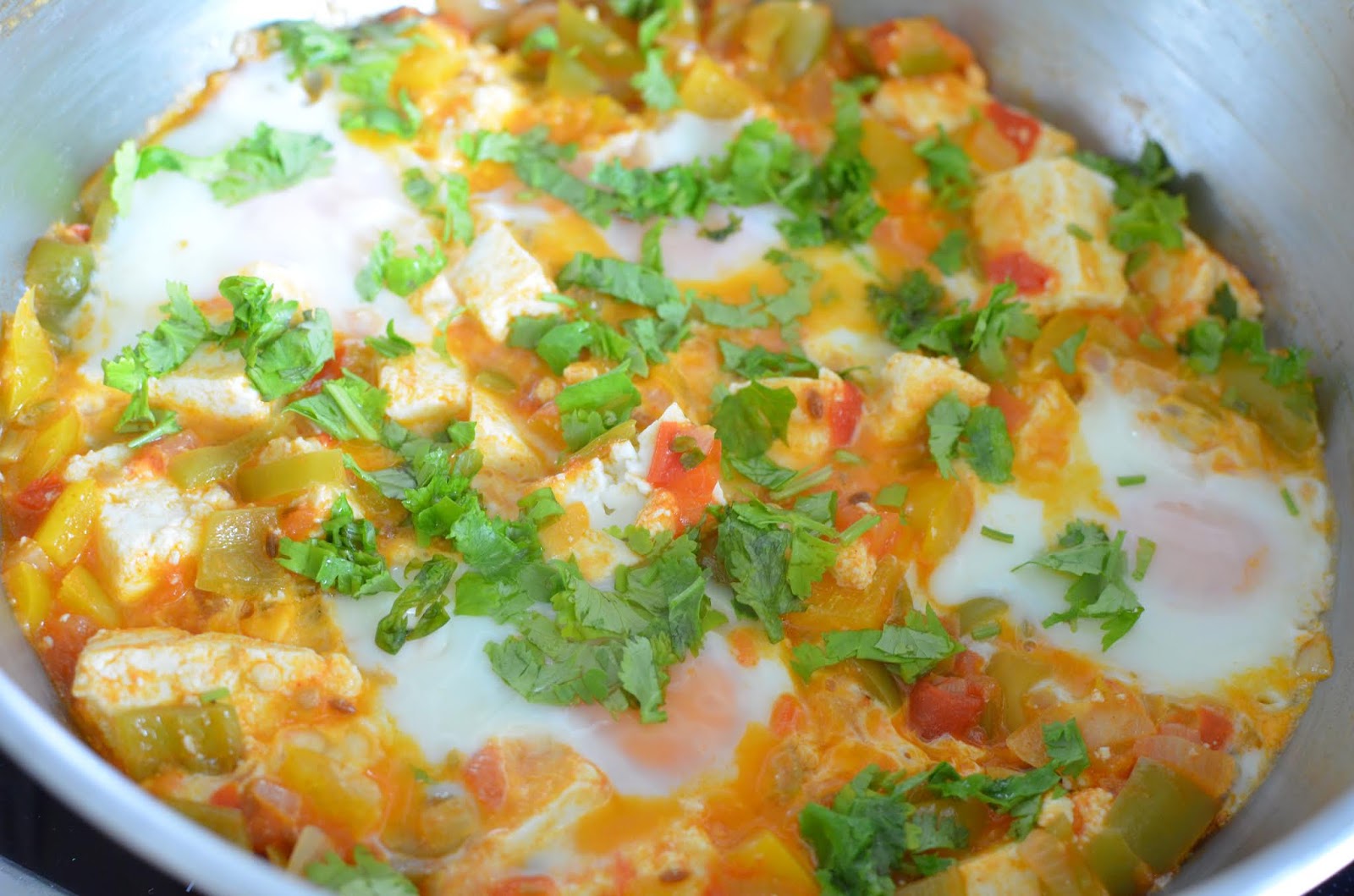 Shakshouka ( Poached eggs in tomato gravy)