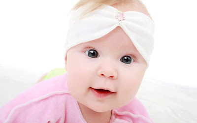 Cute Pink Baby With Beautiful Eyes Wallpaper