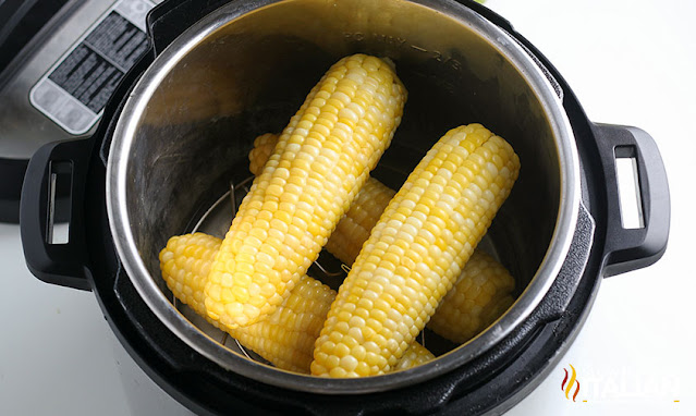 overhead image: ears of corn on the cob in pressure cooker