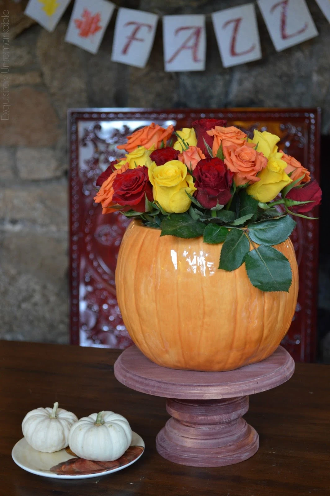 Fall floral arrangement set it pumpkin vase on wooden cake plate