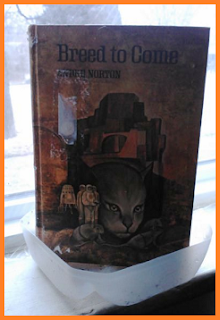 Andre Norton's Breed to Come is standing in a drainage pan made from the bottom of a milk jug.