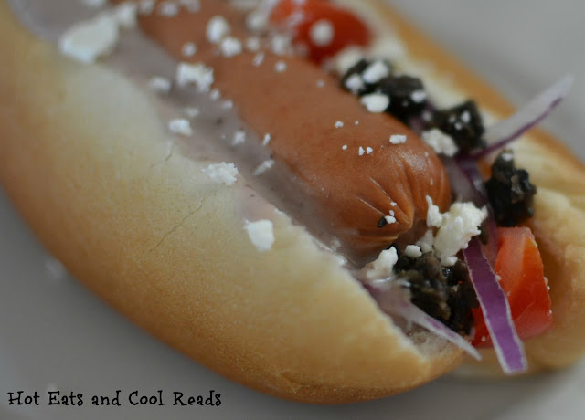 Perfect party food or a quick weeknight dinner! Warm the hot dogs in the slow cooker for easy prep! Greek Hot Dog Recipe from Hot Eats and Cool Reads
